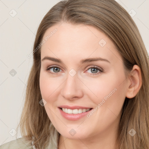 Joyful white young-adult female with long  brown hair and grey eyes