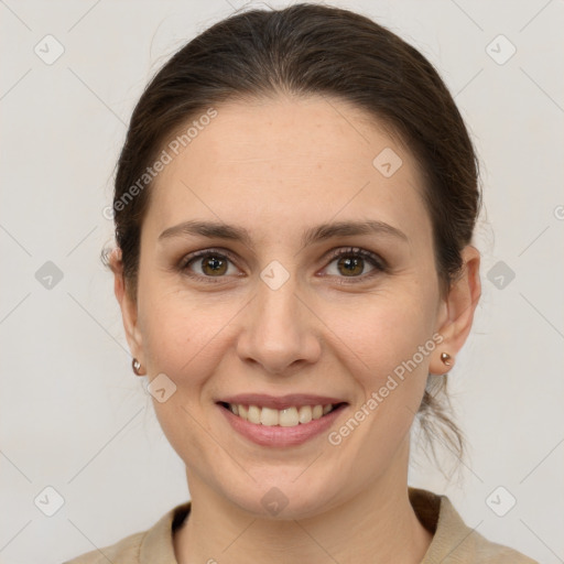 Joyful white adult female with medium  brown hair and grey eyes