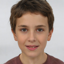 Joyful white child male with short  brown hair and brown eyes