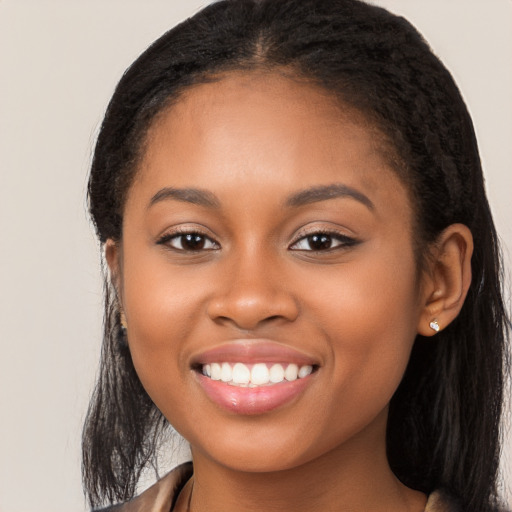 Joyful latino young-adult female with long  black hair and brown eyes