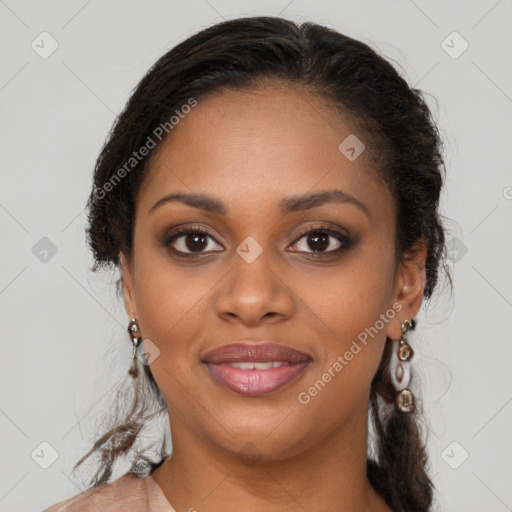 Joyful black young-adult female with long  brown hair and brown eyes