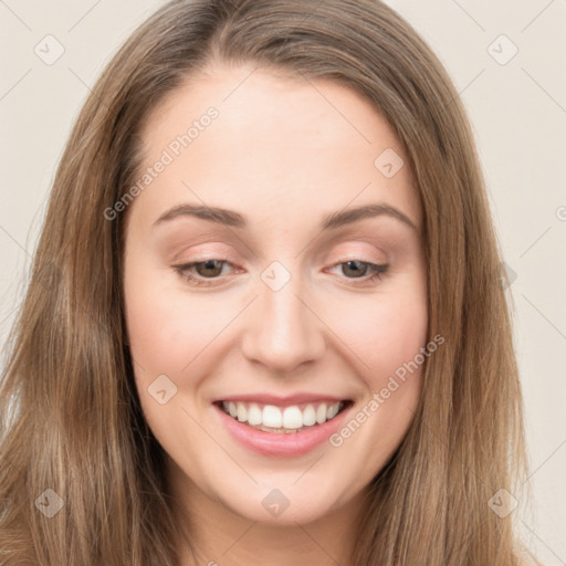 Joyful white young-adult female with long  brown hair and green eyes