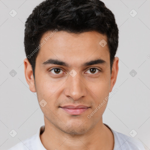 Joyful white young-adult male with short  black hair and brown eyes