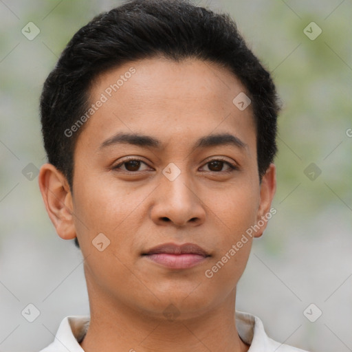 Joyful latino young-adult male with short  brown hair and brown eyes