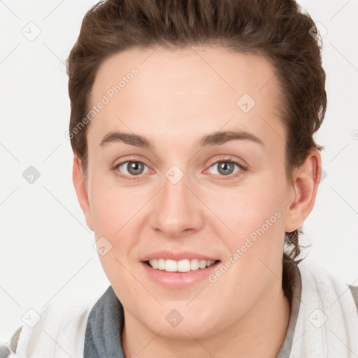 Joyful white young-adult female with short  brown hair and grey eyes