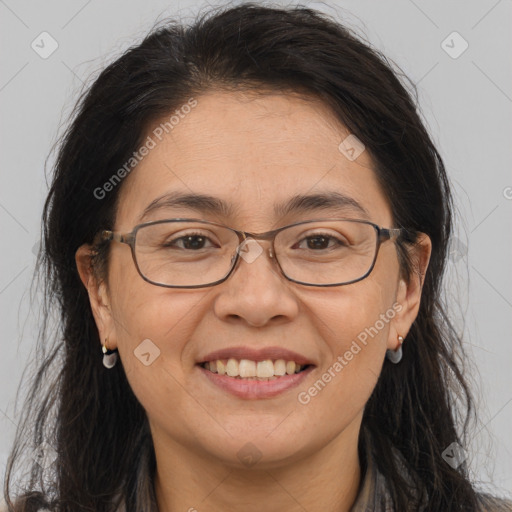 Joyful white adult female with long  brown hair and brown eyes