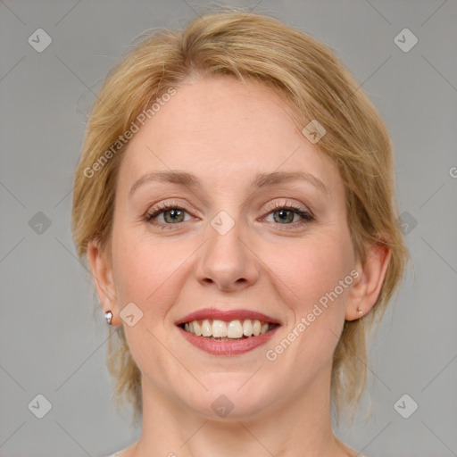 Joyful white adult female with medium  brown hair and blue eyes