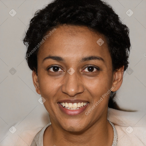 Joyful black young-adult female with short  black hair and brown eyes