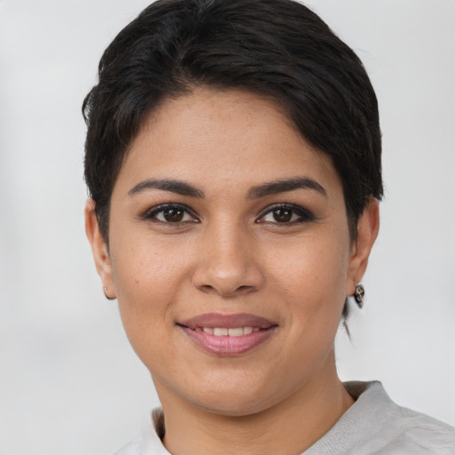 Joyful white young-adult female with short  brown hair and brown eyes