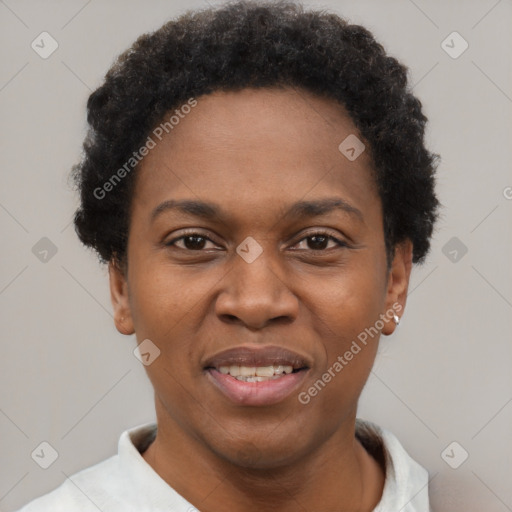 Joyful black young-adult female with short  black hair and brown eyes