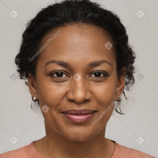 Joyful black adult female with short  brown hair and brown eyes