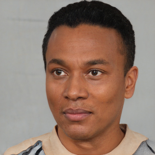 Neutral black young-adult male with short  black hair and brown eyes