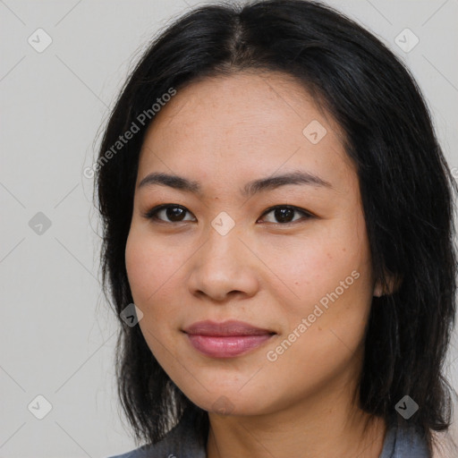 Joyful asian young-adult female with long  brown hair and brown eyes