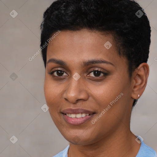 Joyful black young-adult female with short  black hair and brown eyes