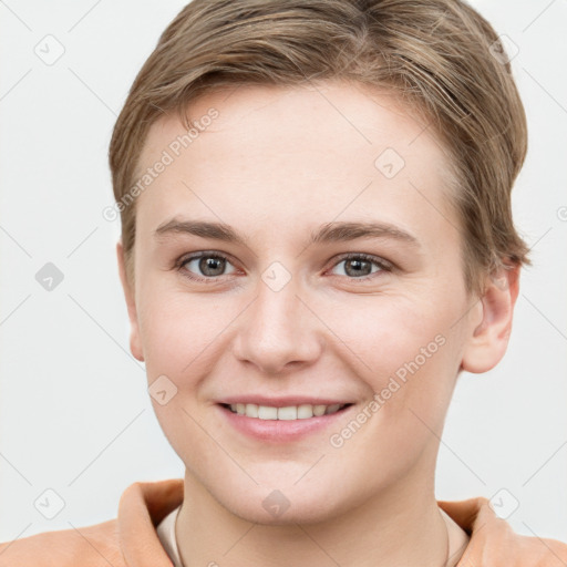 Joyful white young-adult female with short  brown hair and grey eyes