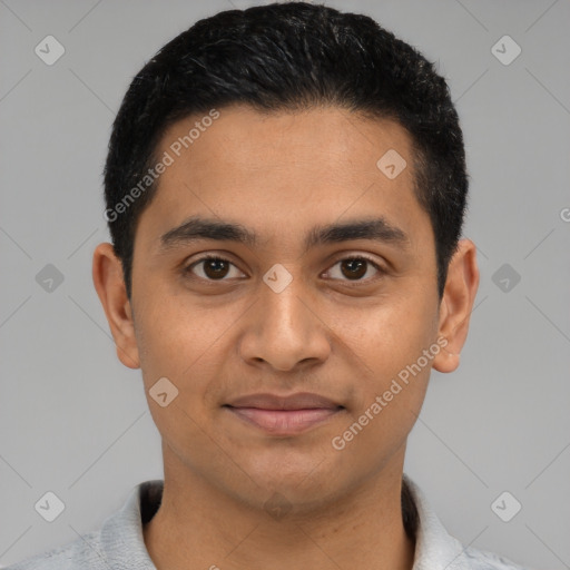 Joyful latino young-adult male with short  black hair and brown eyes