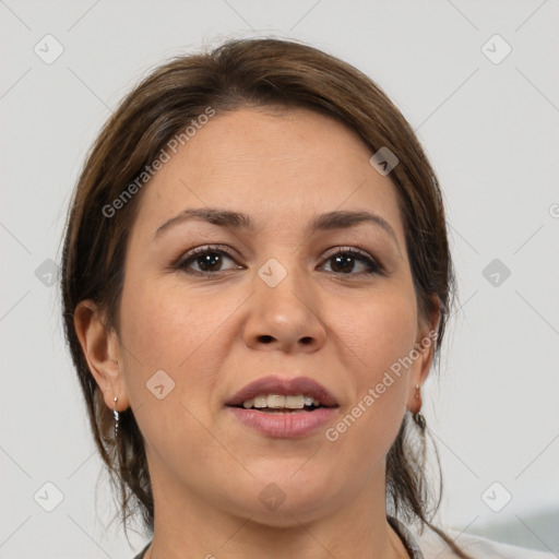 Joyful white adult female with medium  brown hair and brown eyes