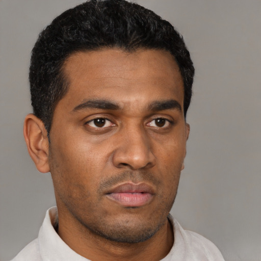 Neutral latino young-adult male with short  black hair and brown eyes