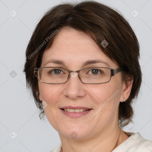 Joyful white adult female with medium  brown hair and brown eyes