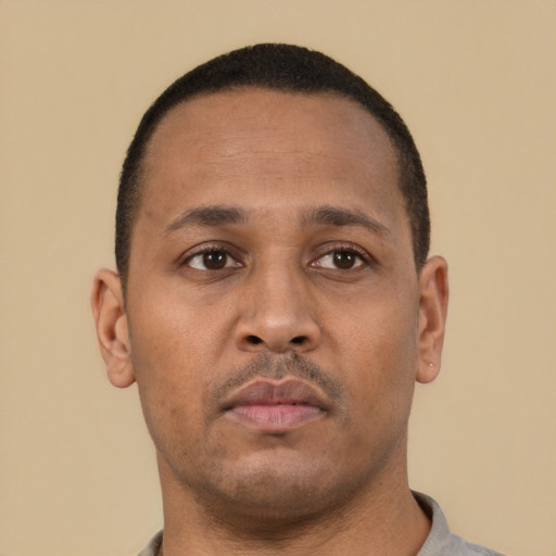 Neutral latino young-adult male with short  brown hair and brown eyes