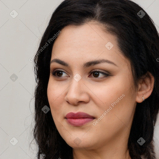 Joyful latino young-adult female with long  brown hair and brown eyes