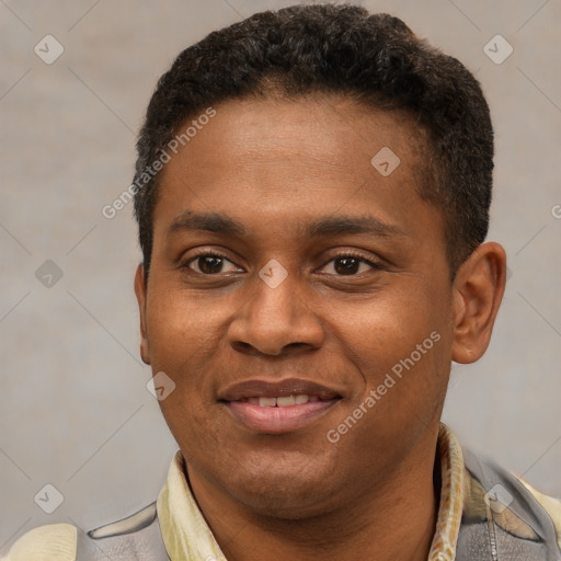 Joyful latino young-adult male with short  brown hair and brown eyes