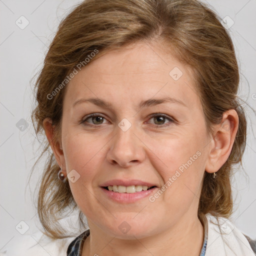 Joyful white adult female with medium  brown hair and grey eyes