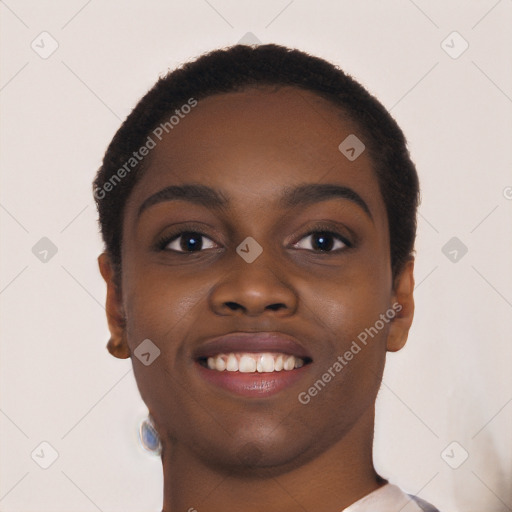 Joyful black young-adult female with short  black hair and brown eyes