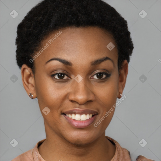 Joyful black young-adult female with short  brown hair and brown eyes