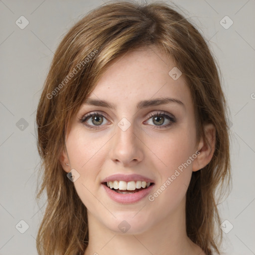 Joyful white young-adult female with medium  brown hair and green eyes