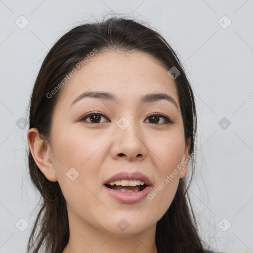 Joyful white young-adult female with long  brown hair and brown eyes