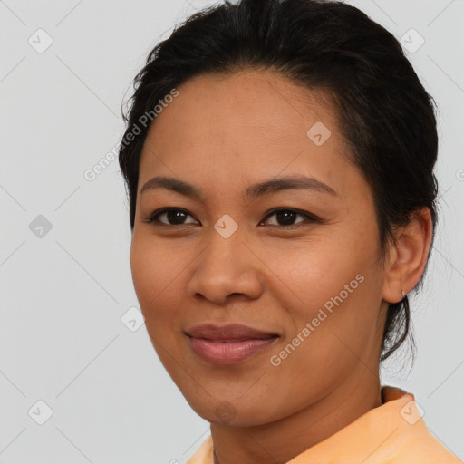 Joyful asian young-adult female with short  brown hair and brown eyes