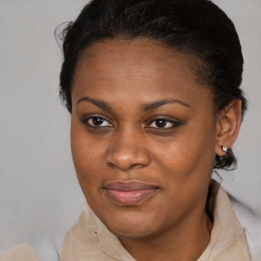 Joyful black young-adult female with medium  brown hair and brown eyes