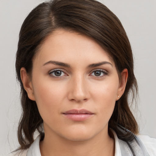 Neutral white young-adult female with medium  brown hair and brown eyes