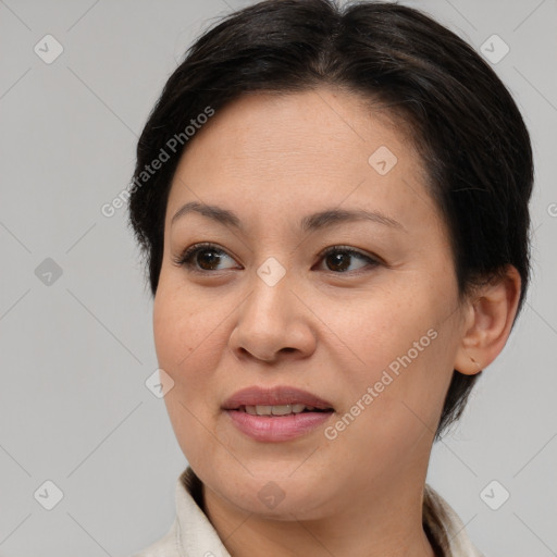 Joyful white adult female with medium  brown hair and brown eyes