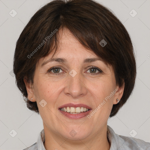 Joyful white adult female with medium  brown hair and brown eyes