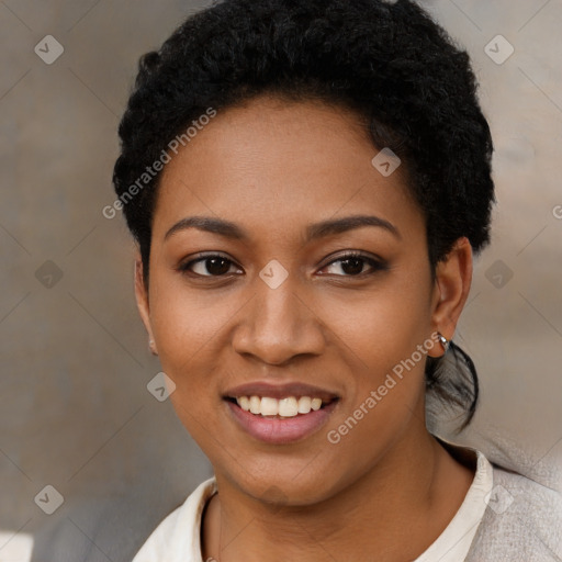 Joyful black young-adult female with short  black hair and brown eyes