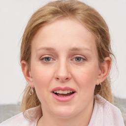 Joyful white young-adult female with medium  brown hair and blue eyes