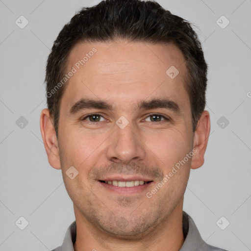 Joyful white young-adult male with short  brown hair and brown eyes