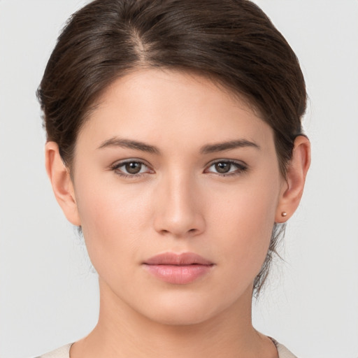 Neutral white young-adult female with medium  brown hair and brown eyes