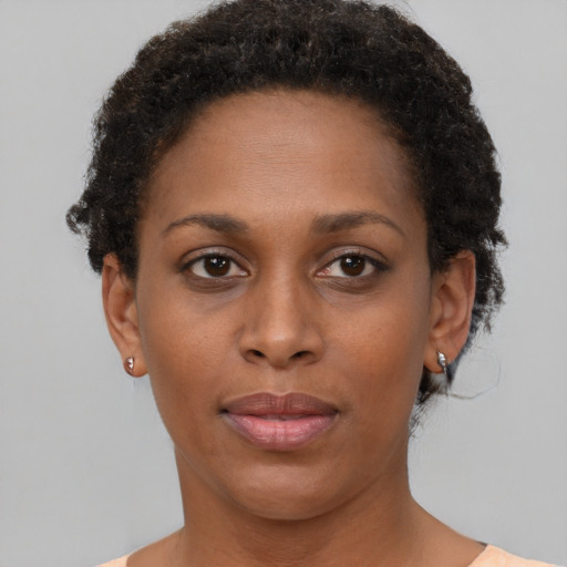 Neutral black young-adult female with short  brown hair and brown eyes
