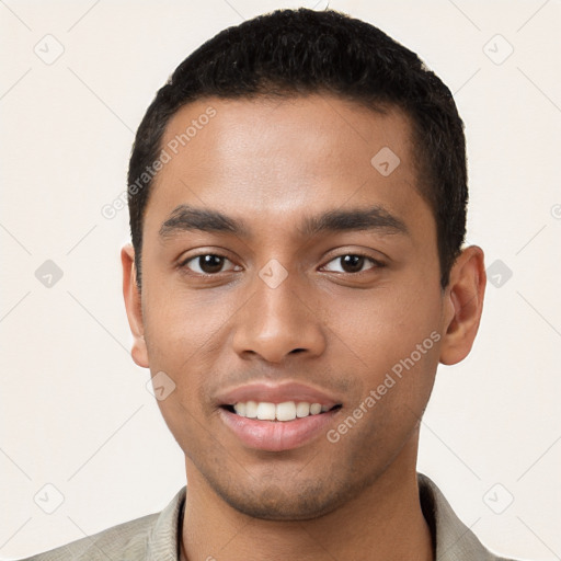 Joyful latino young-adult male with short  brown hair and brown eyes