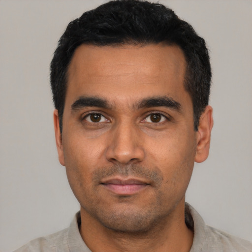 Neutral latino young-adult male with short  black hair and brown eyes