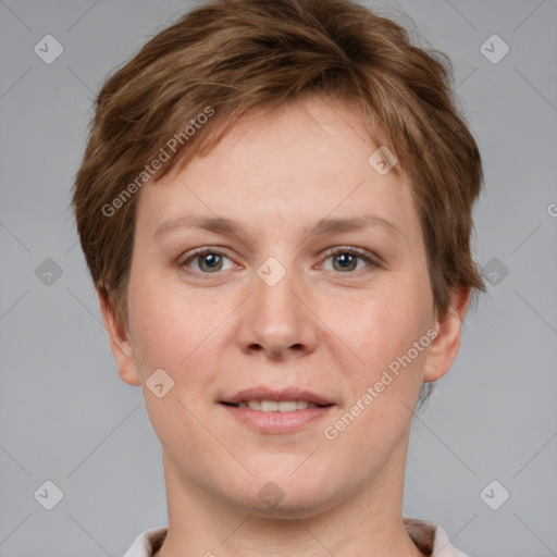 Joyful white young-adult female with short  brown hair and grey eyes