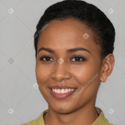 Joyful latino young-adult female with short  black hair and brown eyes