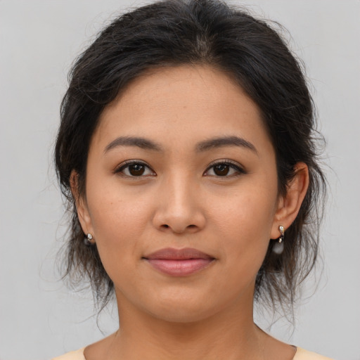 Joyful asian young-adult female with medium  brown hair and brown eyes