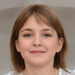 Joyful white child female with medium  brown hair and grey eyes