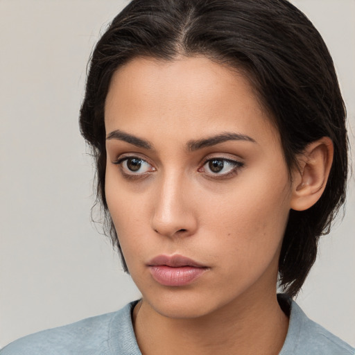 Neutral white young-adult female with medium  brown hair and brown eyes