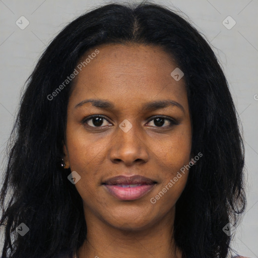 Joyful black young-adult female with long  black hair and brown eyes