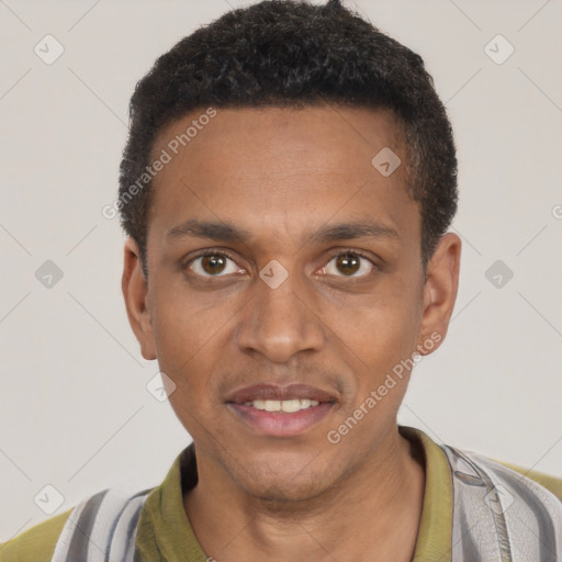 Joyful black young-adult male with short  brown hair and brown eyes